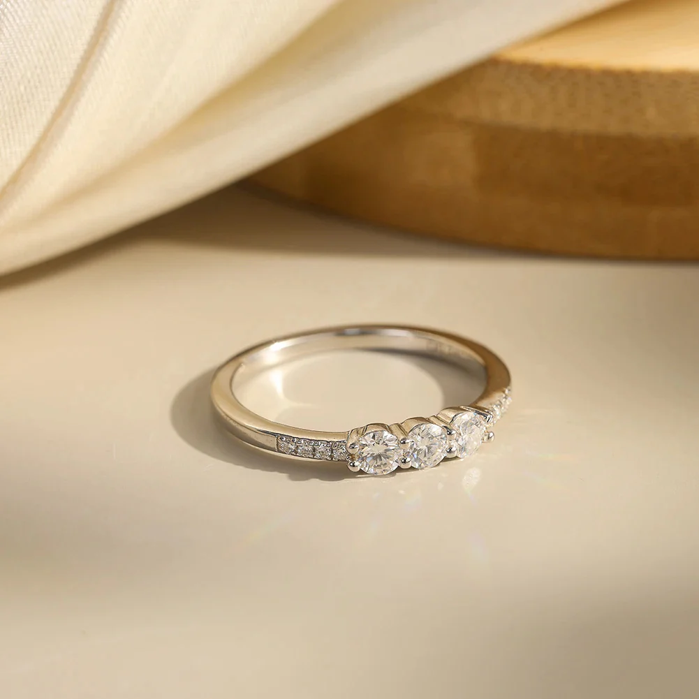 CLASSIC ROUND MOISSANITE THREE-STONE BAND RING IN STERLING SILVER - Image 4
