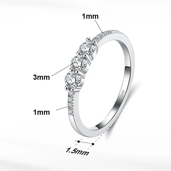 CLASSIC ROUND MOISSANITE THREE-STONE BAND RING IN STERLING SILVER - Image 6