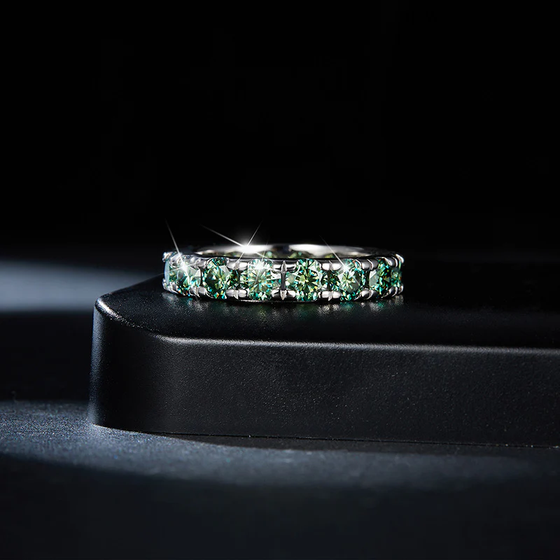 GREEN ROUND MOISSANITE ETERNITY BAND RING IN STERLING SILVER - Image 2