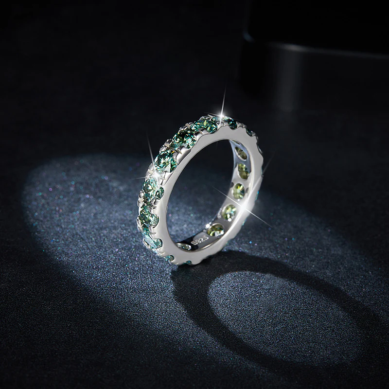 GREEN ROUND MOISSANITE ETERNITY BAND RING IN STERLING SILVER - Image 4