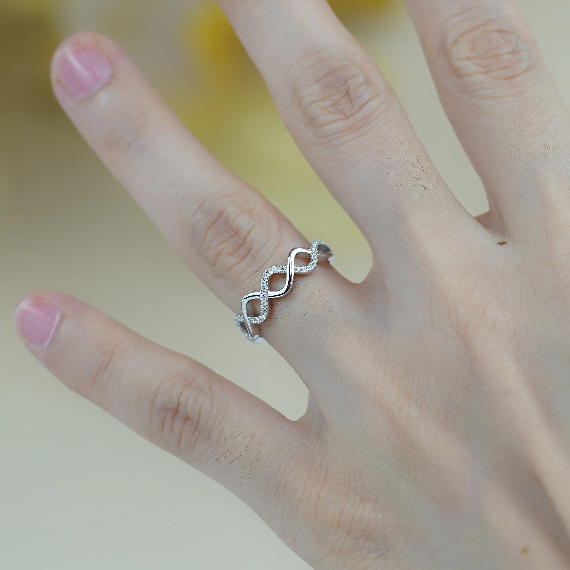 IE0041 MOISSANITE DIAMOND INFINITY RING IN STERLING SILVER - Image 2