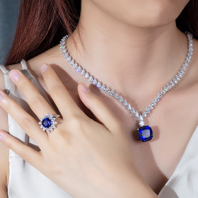 PEAR CUT MOISSANITE AND LAB GROWN SAPPHIRE NECKLACE RING EARRINGS SET IN STERLING SILVER - Image 3