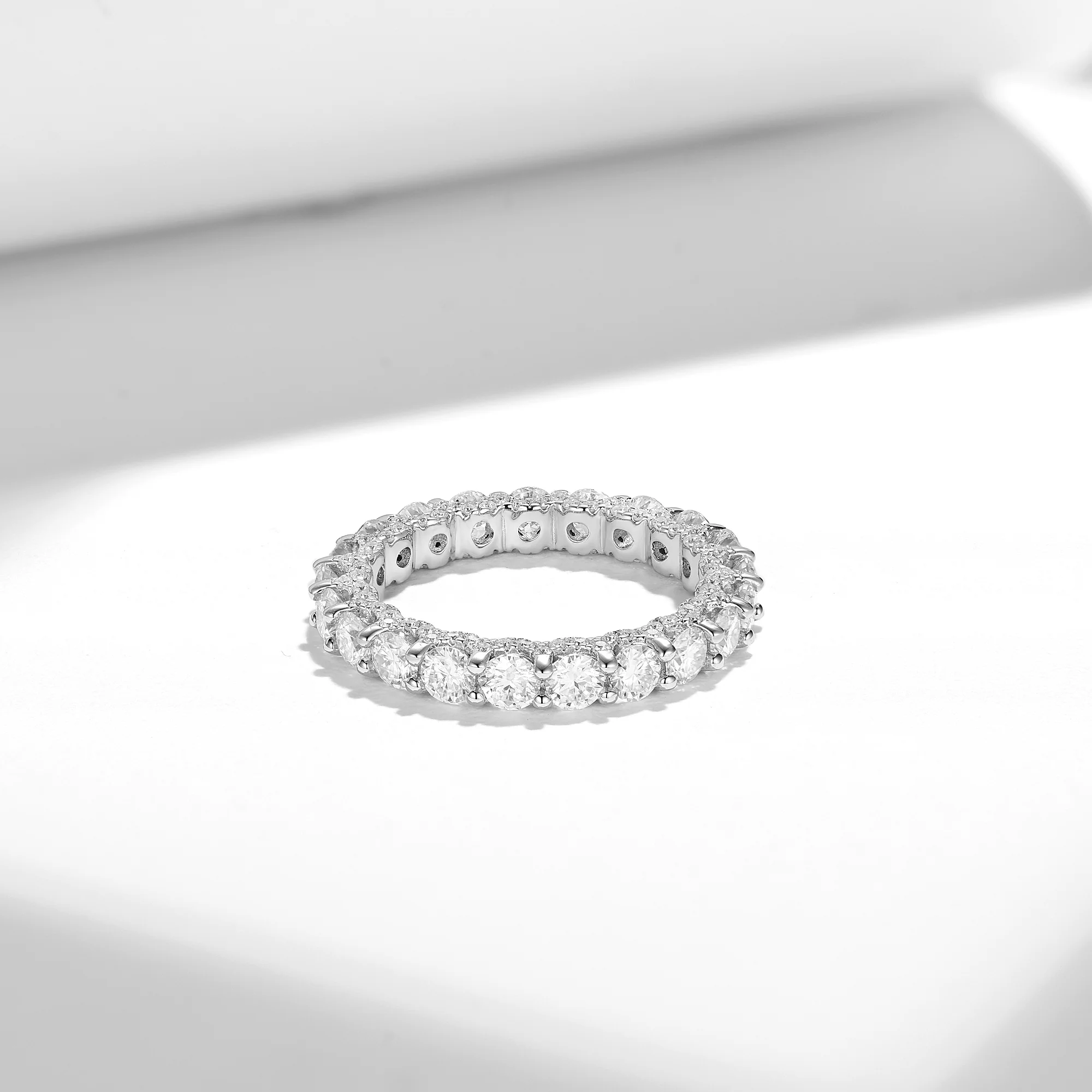 MOISSANITE TENNIS ETERNITY BAND RING WITH SIDE HALO IN STERLING SILVER - Image 4